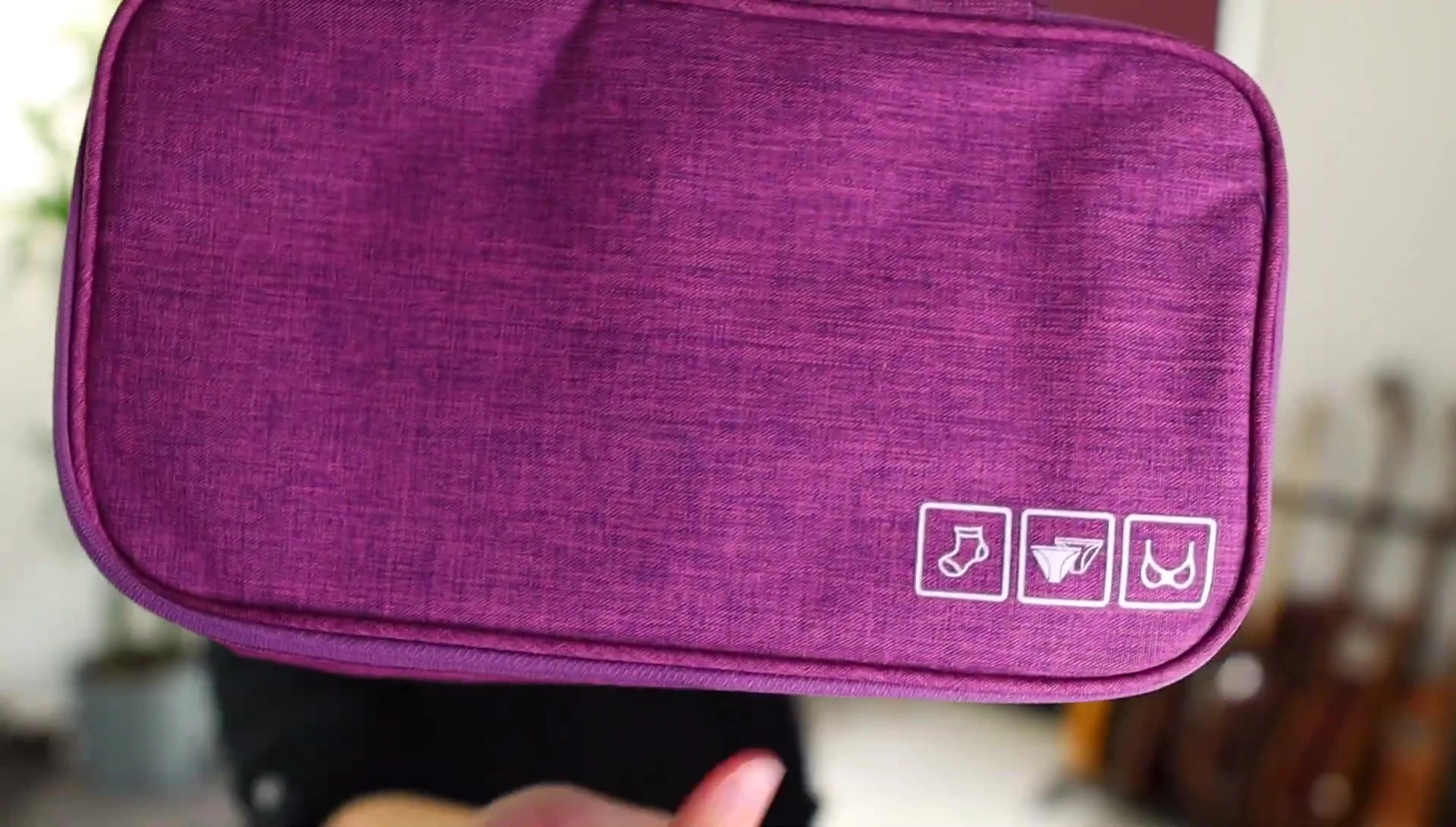 The case designed for socks and underwear, showing its size and compartments.