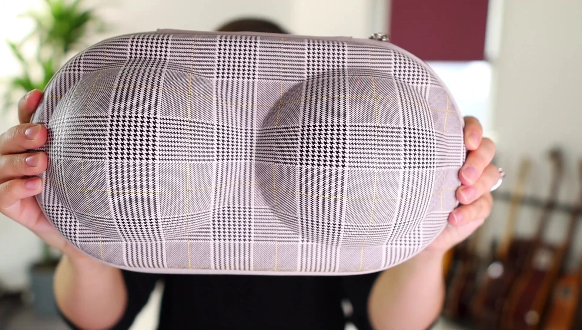 A small-medium sized bra carrying case on Amazon showing its size and shape.