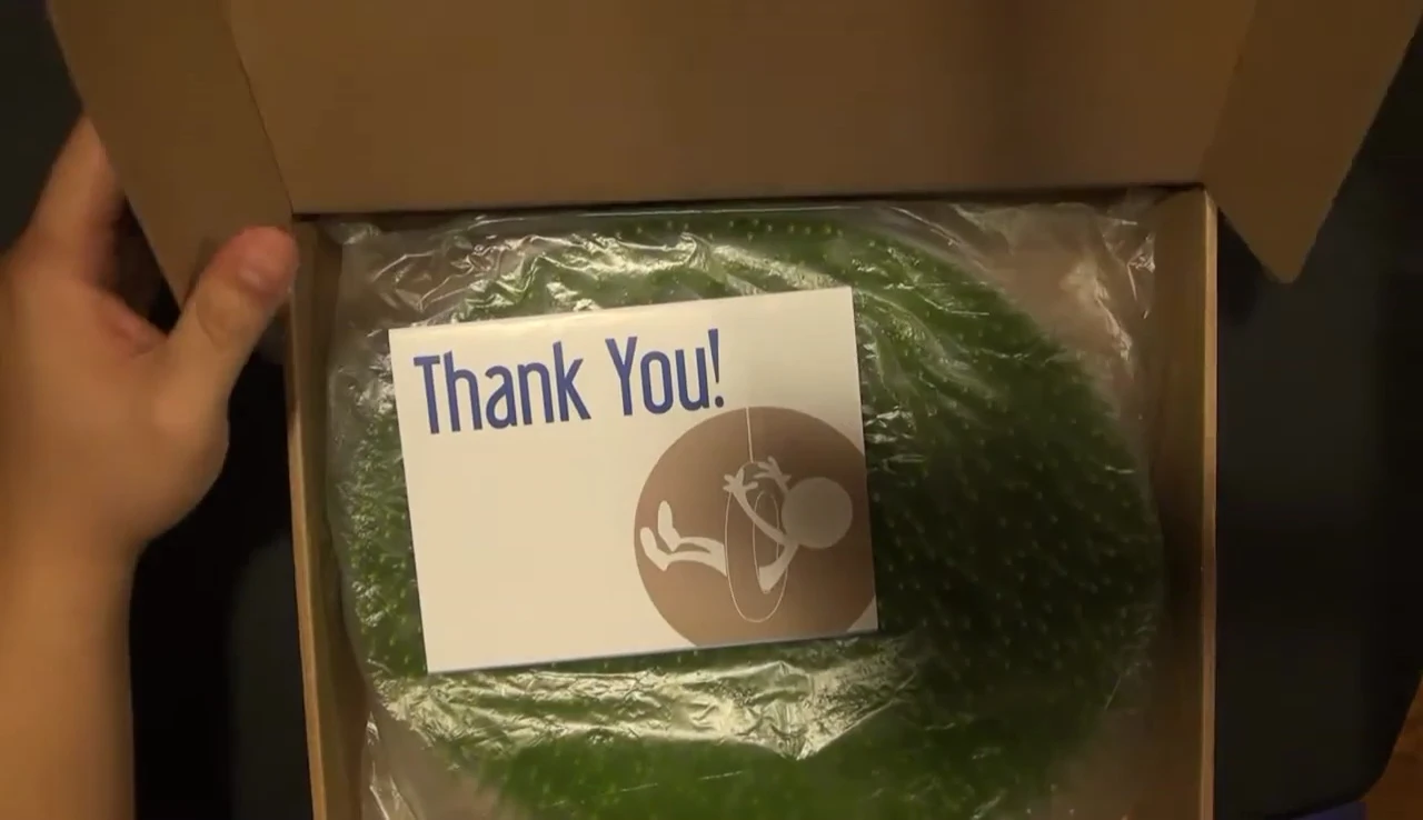 Opening the package to reveal the drying rack and instruction card.