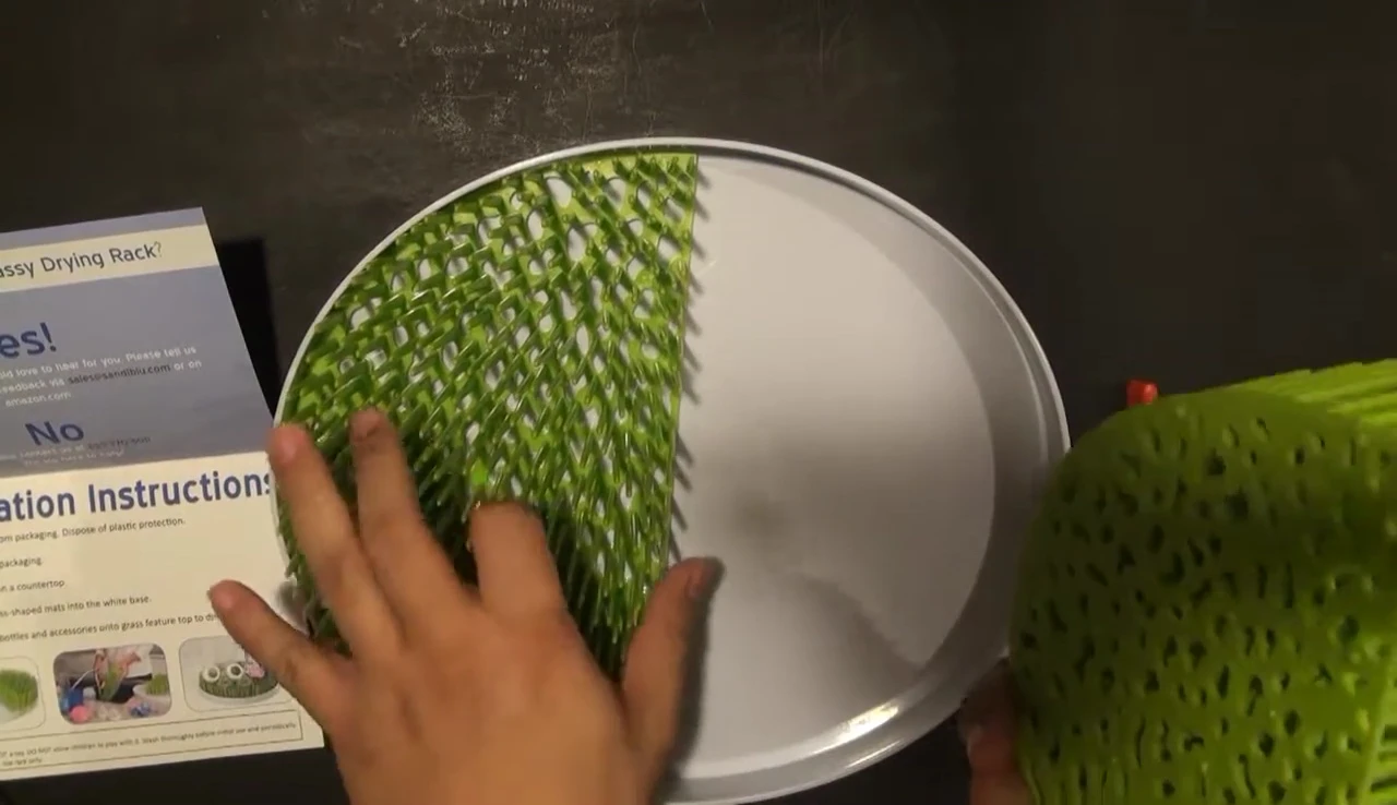 Demonstration of assembling the two tiers of the drying rack.