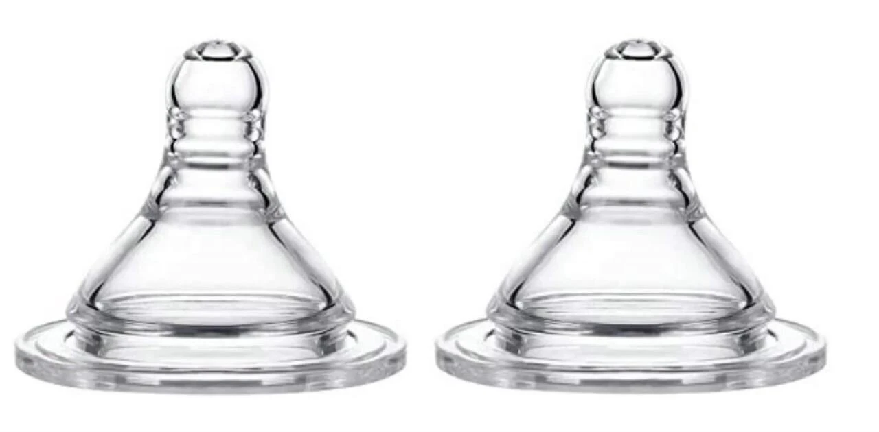 Close-up comparison of round, orthodontic, and angled bottle teats.