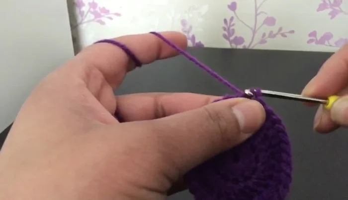 Check fit against bottle. Chain three. Increase round: Work three double crochets in each stitch around. Slip stitch to join.