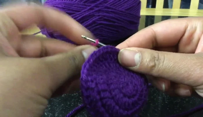 Change to second color. Slip stitch to join and fasten off first color. Chain three.