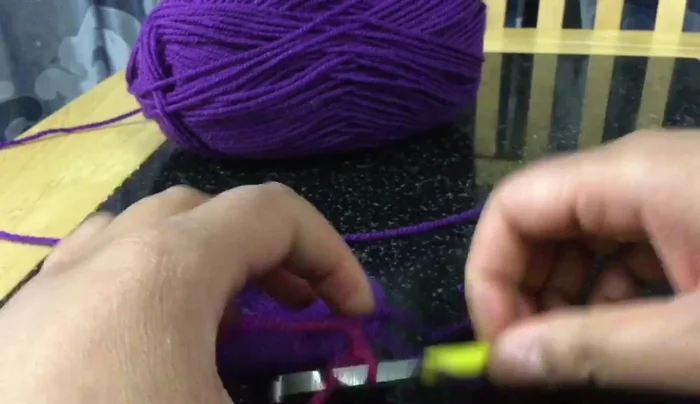 Continue working double crochet stitches in each stitch around for several rows until you reach the desired height for the bottle cover. 