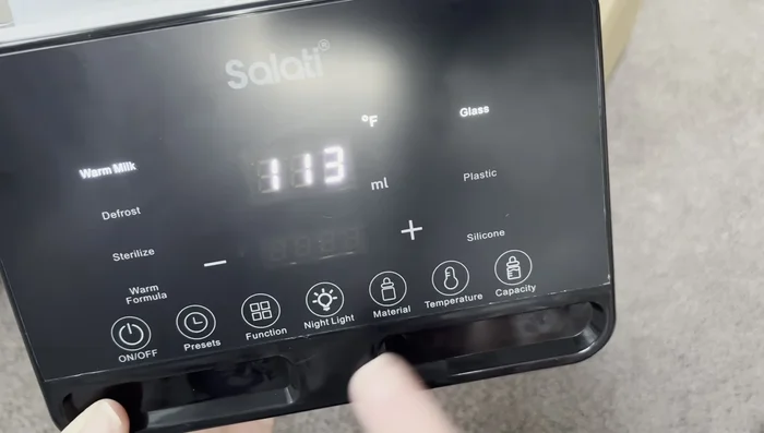 Place the bottle(s) (up to two) into the warmer.