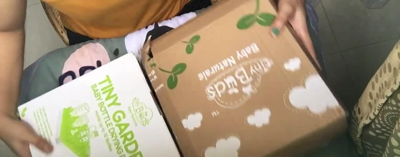 Packaging of the Tiny Buds Garden Baby Bottle Rack