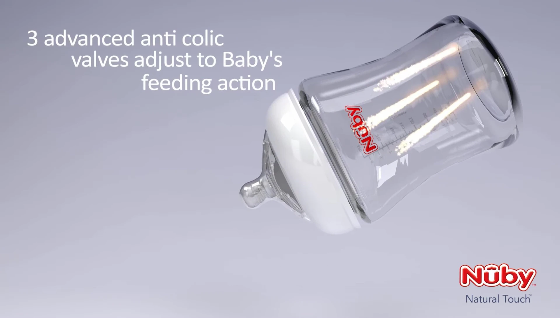 Baby happily feeding from the Nuby bottle