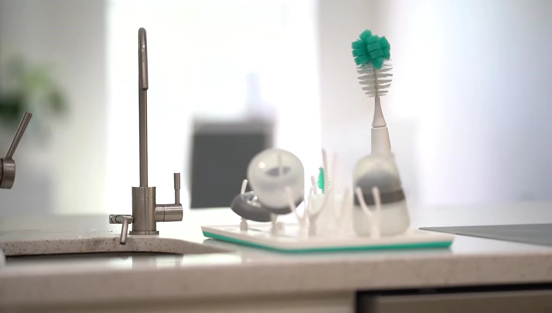 A shot showing the brush's compact size in relation to other kitchen items.